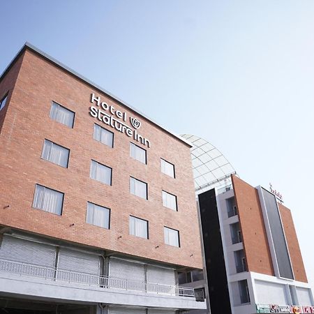 Hotel Stature Inn Kevadia Exteriör bild